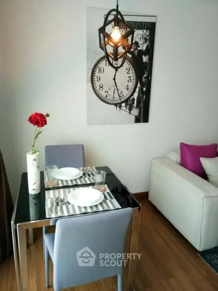 Stylish dining area with modern decor and cozy seating in a contemporary apartment.