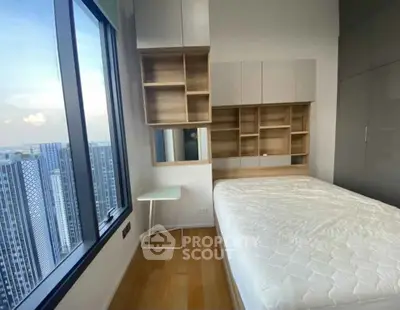 Modern bedroom with stunning city view and stylish storage solutions
