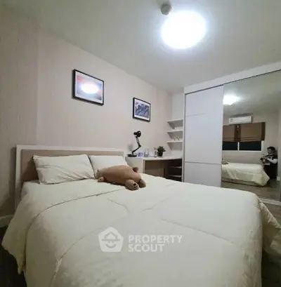 Cozy bedroom with modern decor and ample storage space