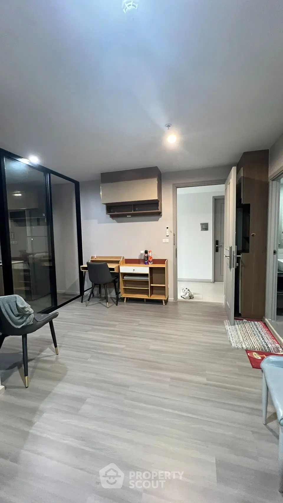 Modern living room with sleek flooring and stylish furniture in a contemporary apartment.