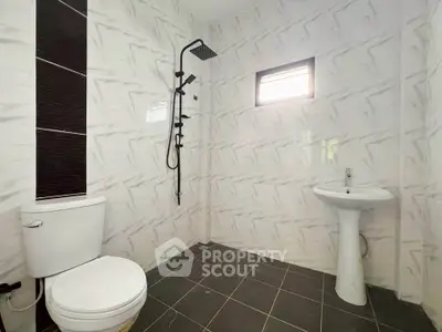 Modern bathroom with sleek fixtures and stylish tile design