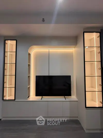 Modern living room with sleek built-in TV unit and ambient lighting