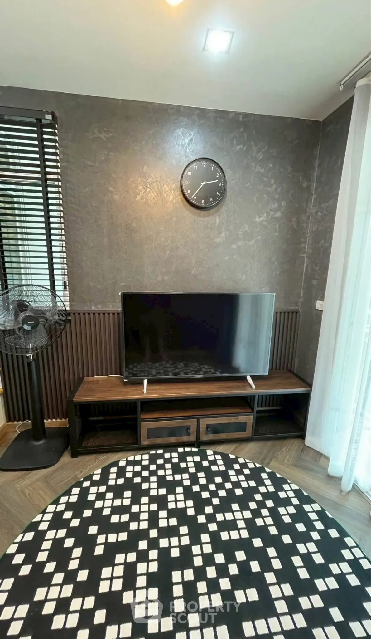 Modern living room with stylish decor and flat-screen TV