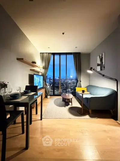 Modern living room with city view, stylish furniture, and elegant decor in a high-rise apartment.