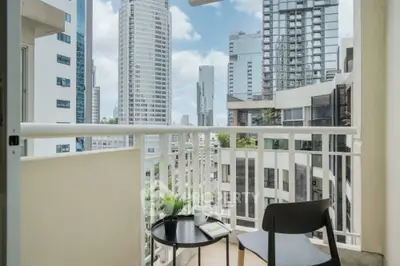 Chic city balcony with modern skyline view, perfect for urban living.