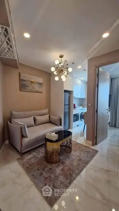 Modern living room with elegant decor and open kitchen layout