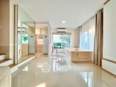 Spacious modern living room with large windows and sleek design