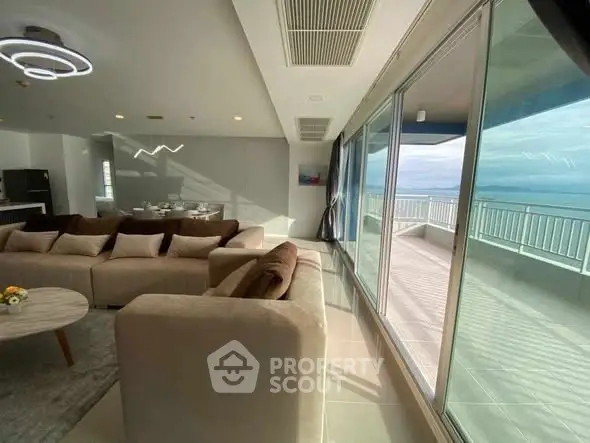 Luxurious living room with ocean view and spacious balcony access