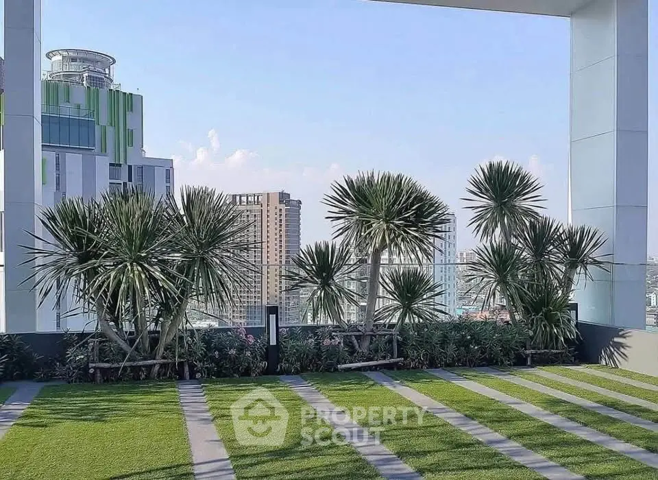 Stunning rooftop garden with lush greenery and city skyline views, perfect for relaxation and leisure.