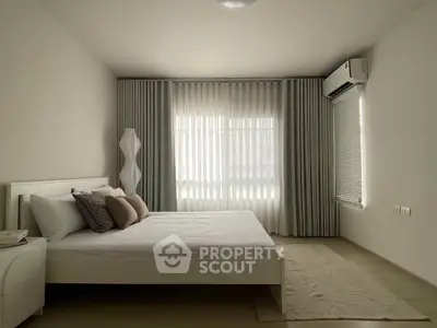 Modern minimalist bedroom with elegant curtains and air conditioning