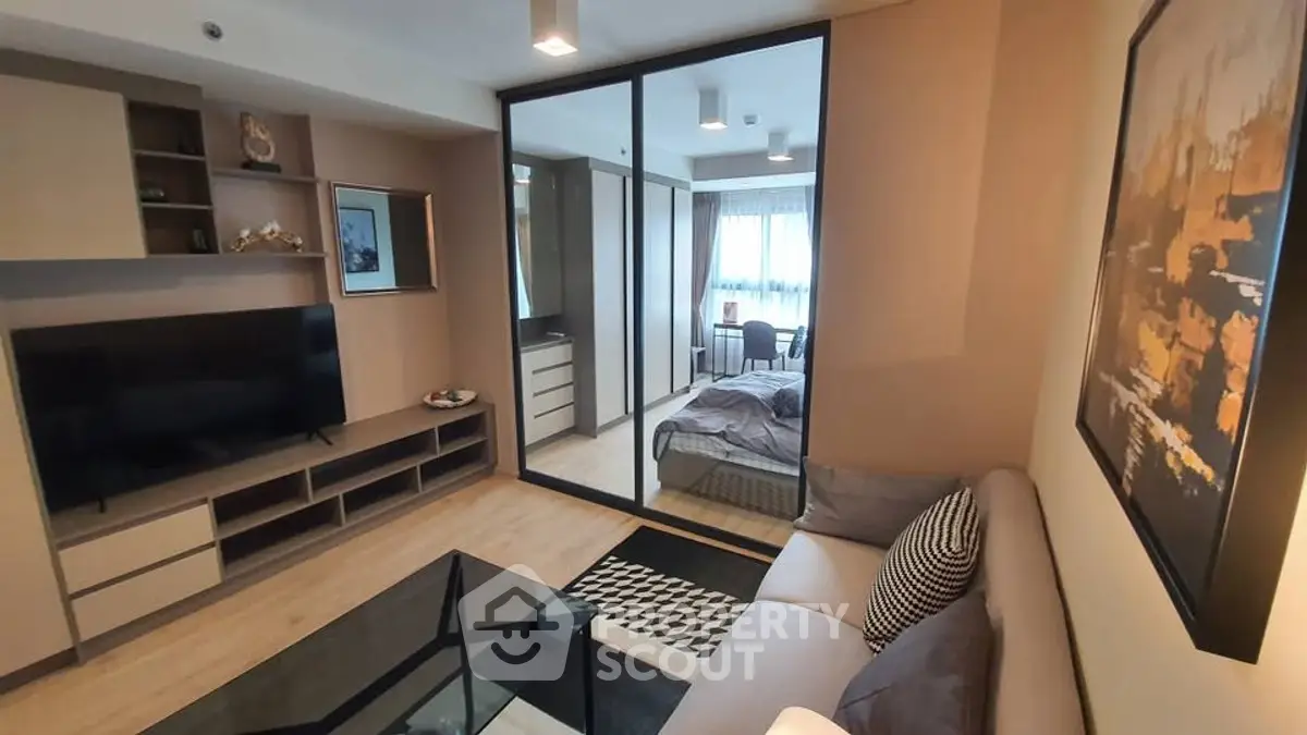 Modern living room with stylish decor and bedroom view