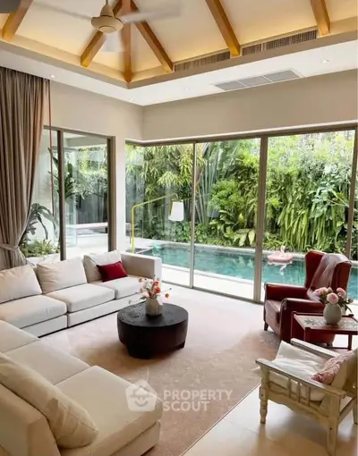 Luxurious living room with pool view and elegant decor