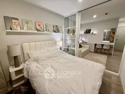 Modern bedroom with stylish decor and cozy ambiance in a contemporary apartment.