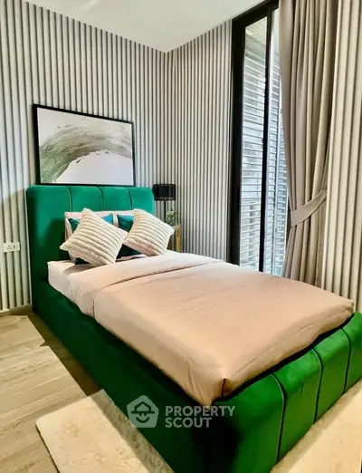 Luxurious bedroom with modern green bed and stylish decor
