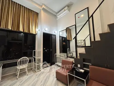 Modern duplex living room with high ceilings and stylish decor