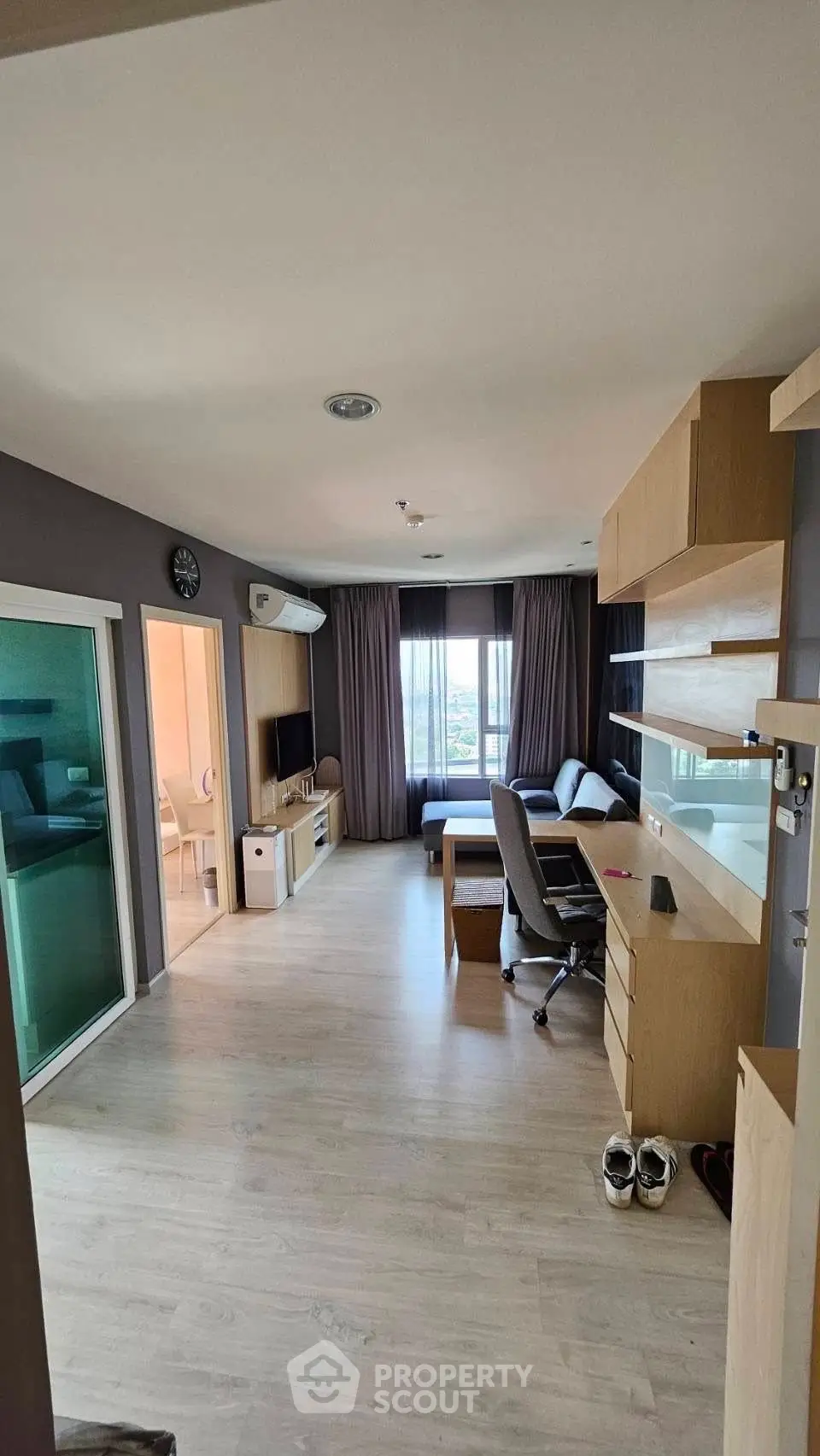 Modern living room with study area and large window view