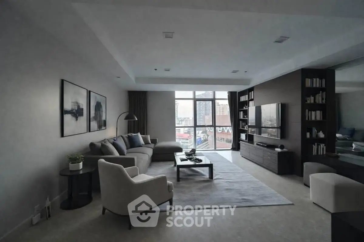 Spacious modern living room with large windows and stylish decor