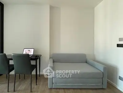 Modern minimalist living room with sleek furniture and wooden flooring