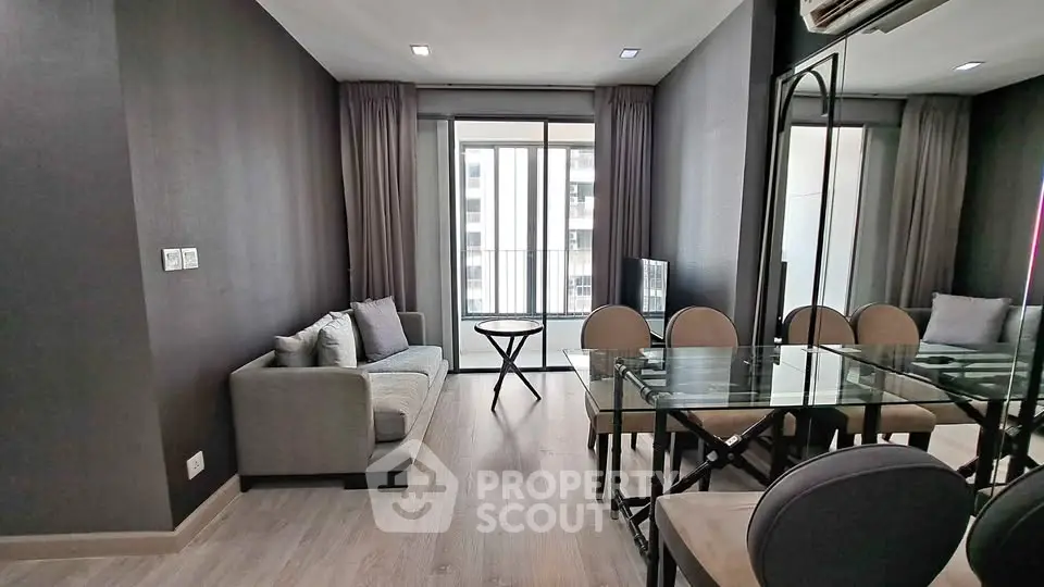 Modern living room with elegant dining area and large windows