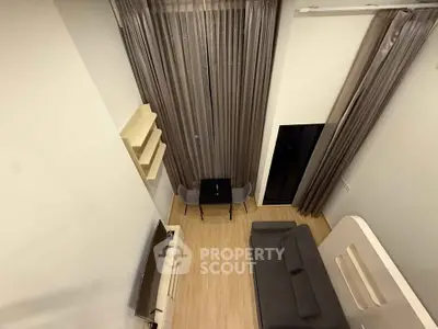 Modern loft-style living room with high ceilings and elegant decor