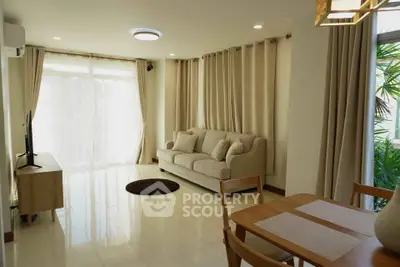 Spacious living room with elegant decor and natural light