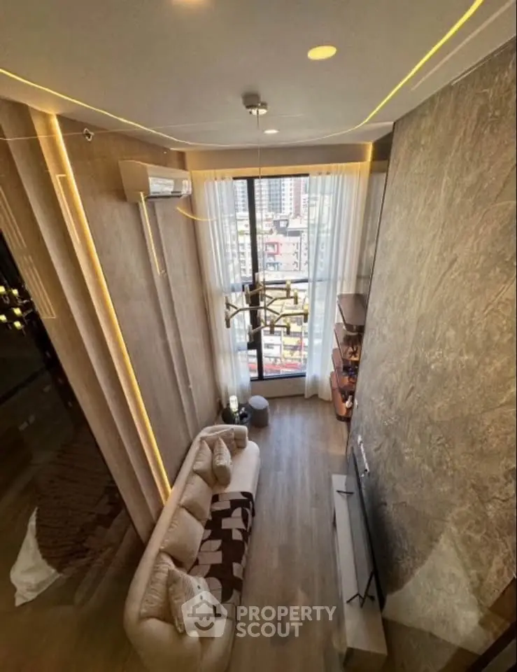 Luxurious high-ceiling living room with modern decor and city view, perfect for urban living.