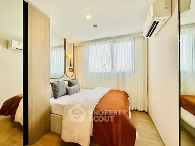 Cozy modern bedroom with large windows and stylish decor