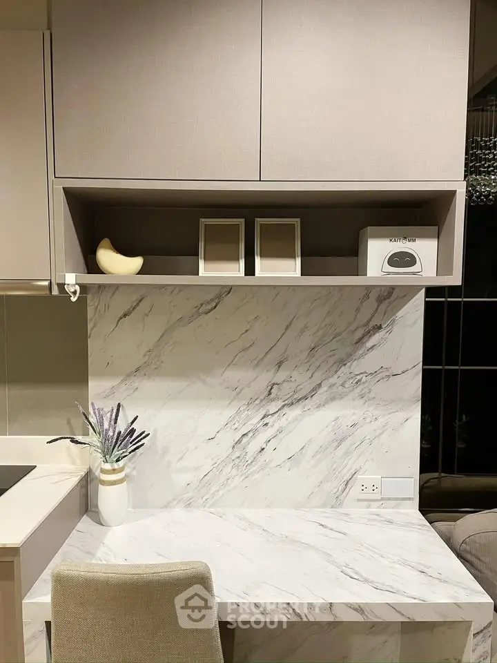 Modern kitchen with marble backsplash and sleek cabinetry