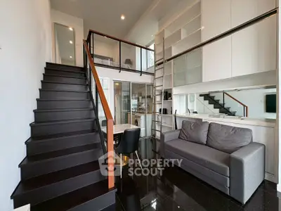 Modern loft apartment with sleek staircase and stylish living area