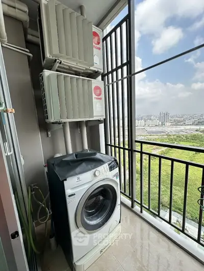 High-rise balcony with washing machine and city view, perfect for urban living convenience.