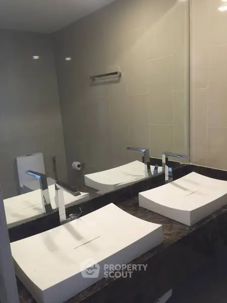 Modern bathroom with dual sinks and sleek design