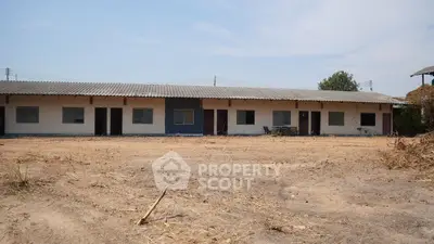 Spacious single-story building with multiple units in a serene setting, ideal for development opportunities.