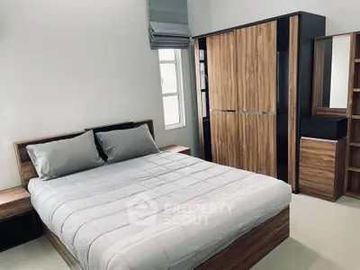 Modern bedroom with stylish wooden furniture and natural light