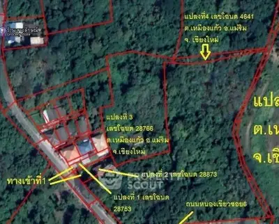 Aerial view of property plots with boundary lines in a lush green area, ideal for real estate development.