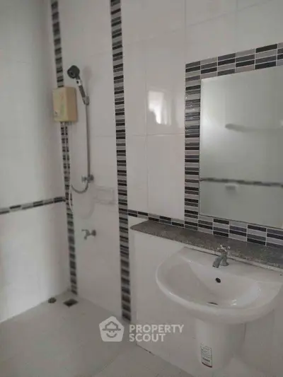 Modern bathroom with sleek tiles and contemporary fixtures