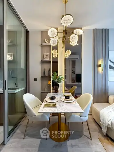 Modern dining area with elegant lighting and stylish decor in a contemporary apartment.