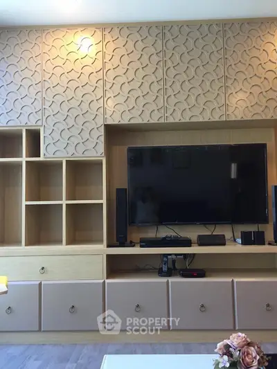 Modern living room with stylish TV unit and decorative wall panels