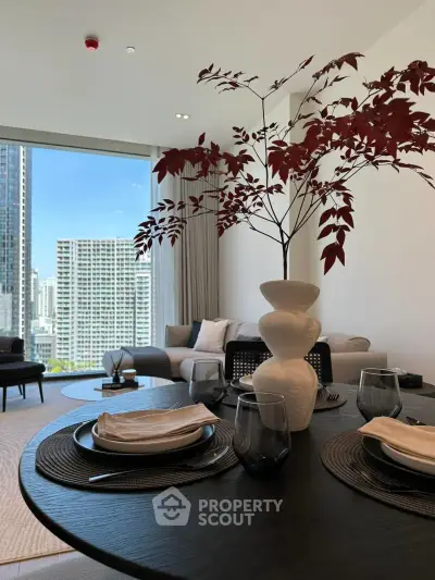 Modern living room with elegant decor and stunning city view, featuring stylish furniture and a cozy ambiance.