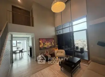 Luxurious modern living room with high ceilings and city view balcony