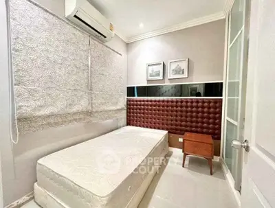 Cozy bedroom with air conditioning and stylish decor in modern apartment