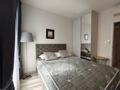 Cozy bedroom with modern decor and mirrored wardrobe