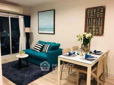 Modern living room with stylish decor and dining area in a high-rise apartment.