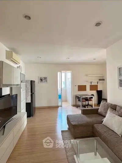 Spacious living room with modern furniture and natural light