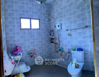 Spacious bathroom with modern shower and playful decor