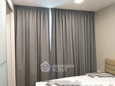 Cozy bedroom with modern curtains and stylish bedding