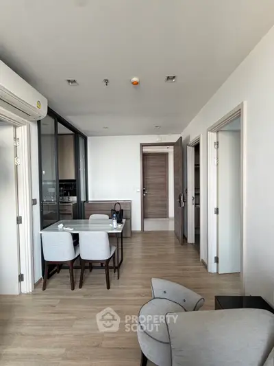 Modern apartment interior with open layout dining area and stylish furniture