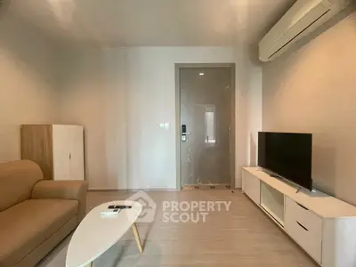 Modern living room with sleek furniture and air conditioning