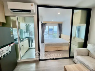 Modern apartment interior with open layout, featuring a cozy living room, sleek kitchen, and bright bedroom.