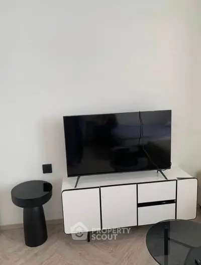 Modern living room with sleek TV stand and minimalist decor