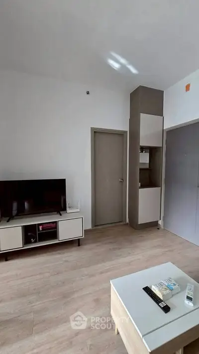 Modern living room with sleek TV stand and minimalist decor